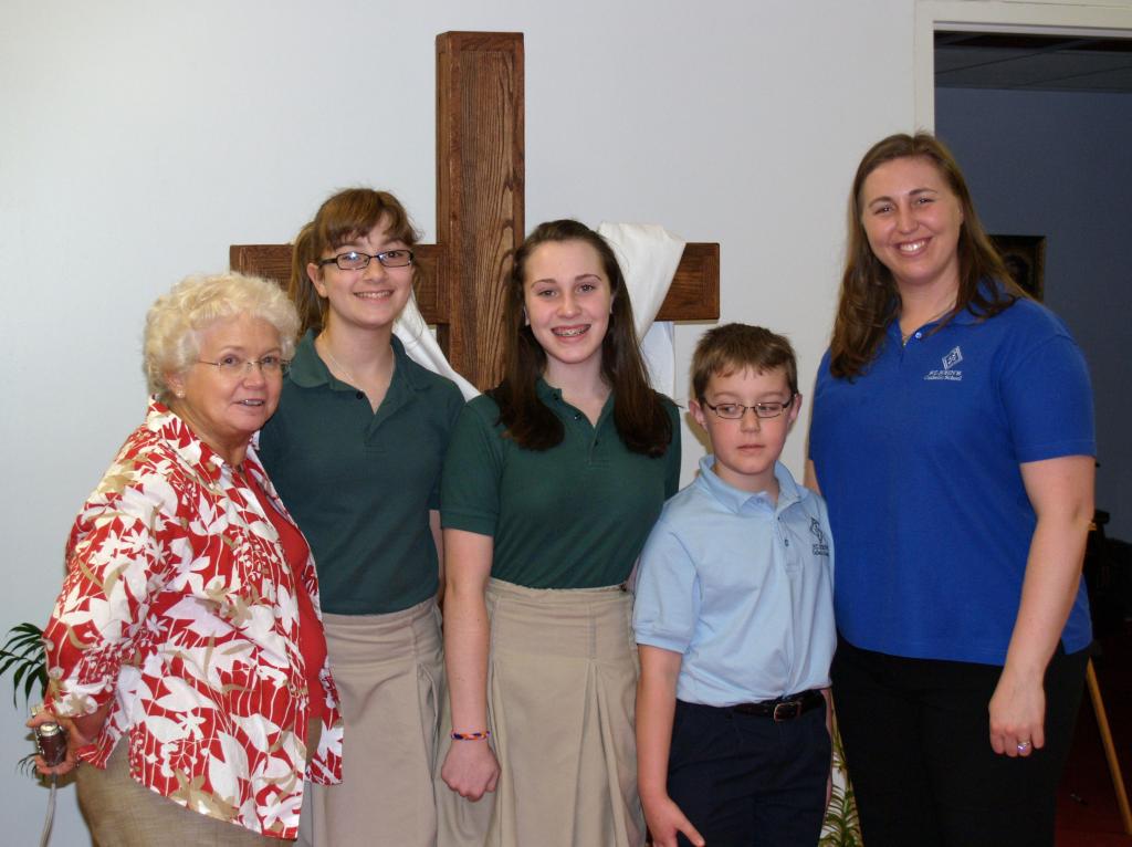 The Ladies of Sacred Heart of Jesus funded a $1,200 scholarship to St. John’s Catholic School in Hot Springs as part of their annual disbursement of charitable fund raising proceeds for the year.  Pictured are Sheila Harrison, 2010-2011 president of the Ladies of Sacred Heart, St. John’s students Megan Shaffer, Lexi Myers, and Dayton Myers, and St. John’s Principal, Elizabeth Shackelford.  The scholarship is intended to help defray tuition costs for students from lower income households.
